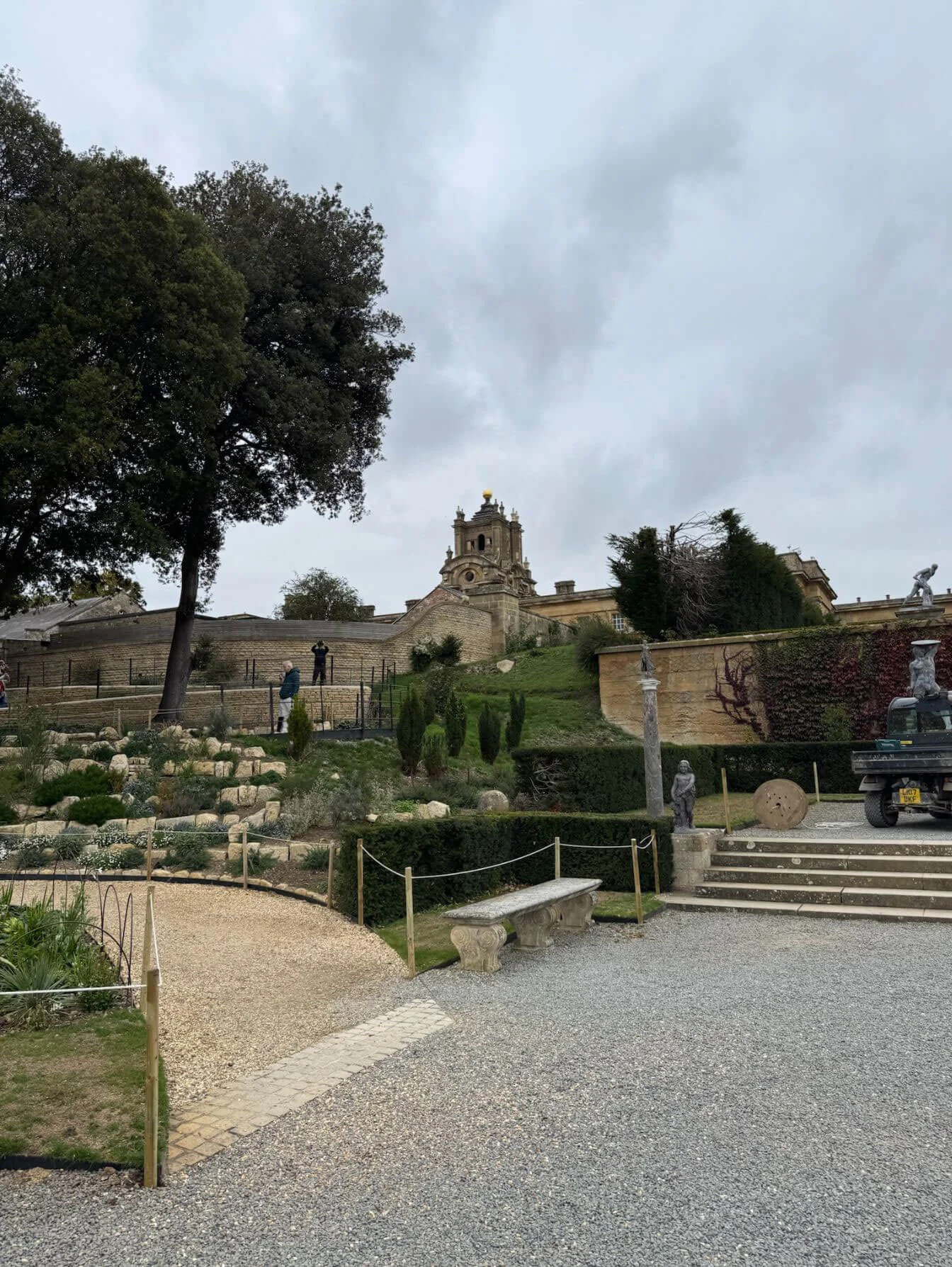 Palace beyond geometric terraces and clipped planting