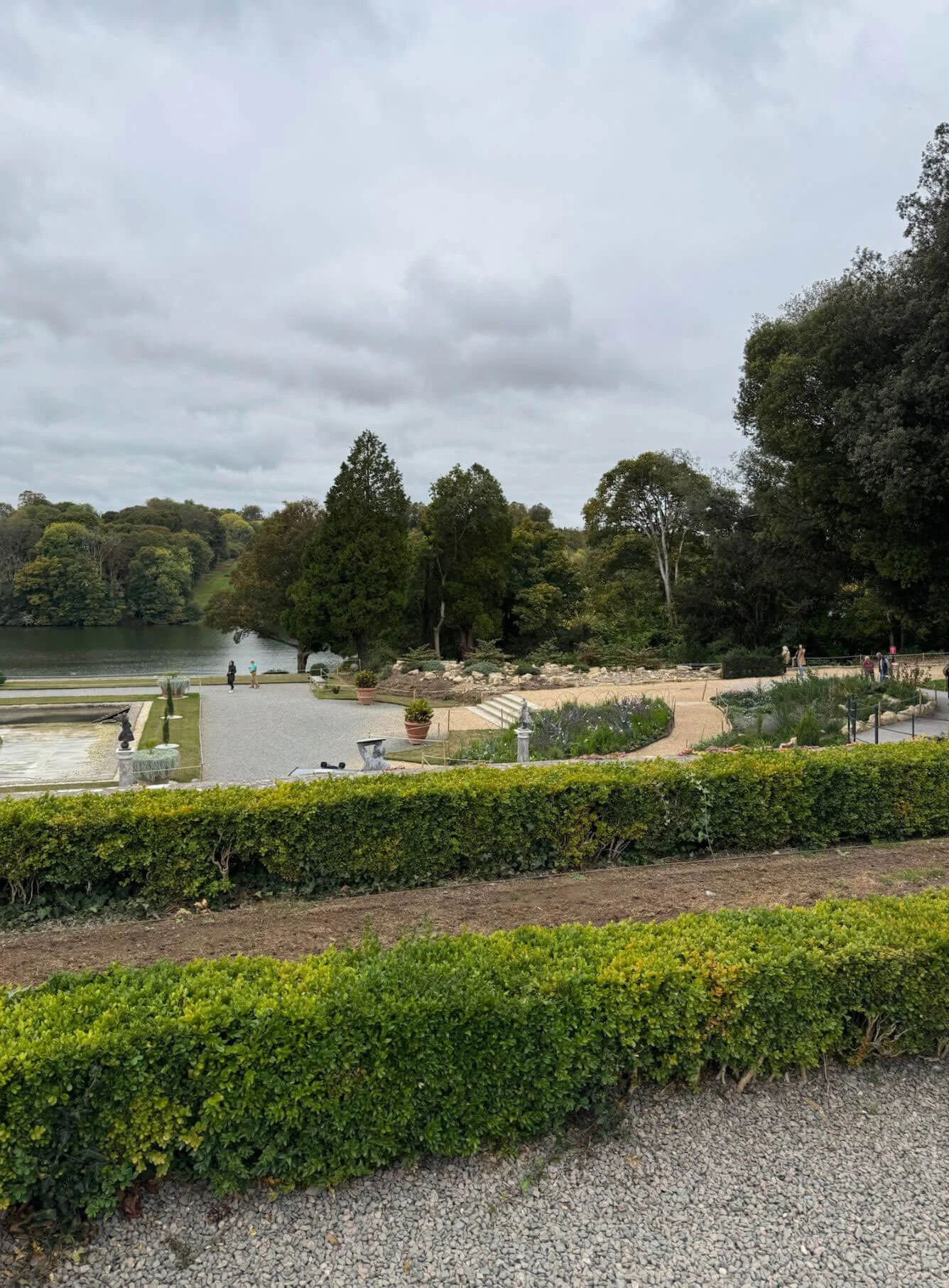 Formal garden beds overlooking a water terrace