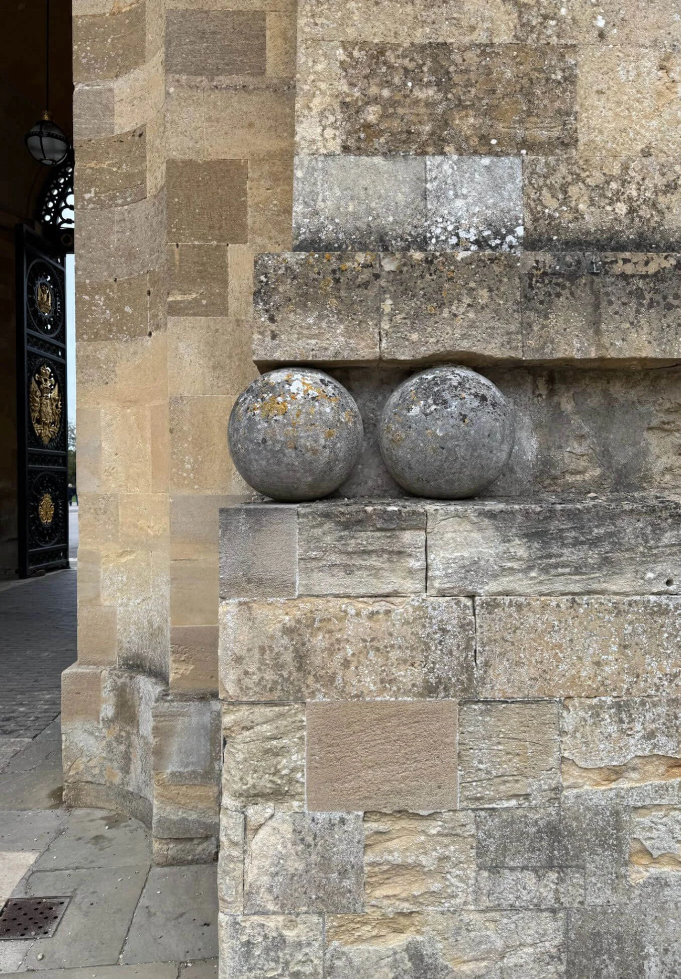 Carved stone spheres set into a masonry wall