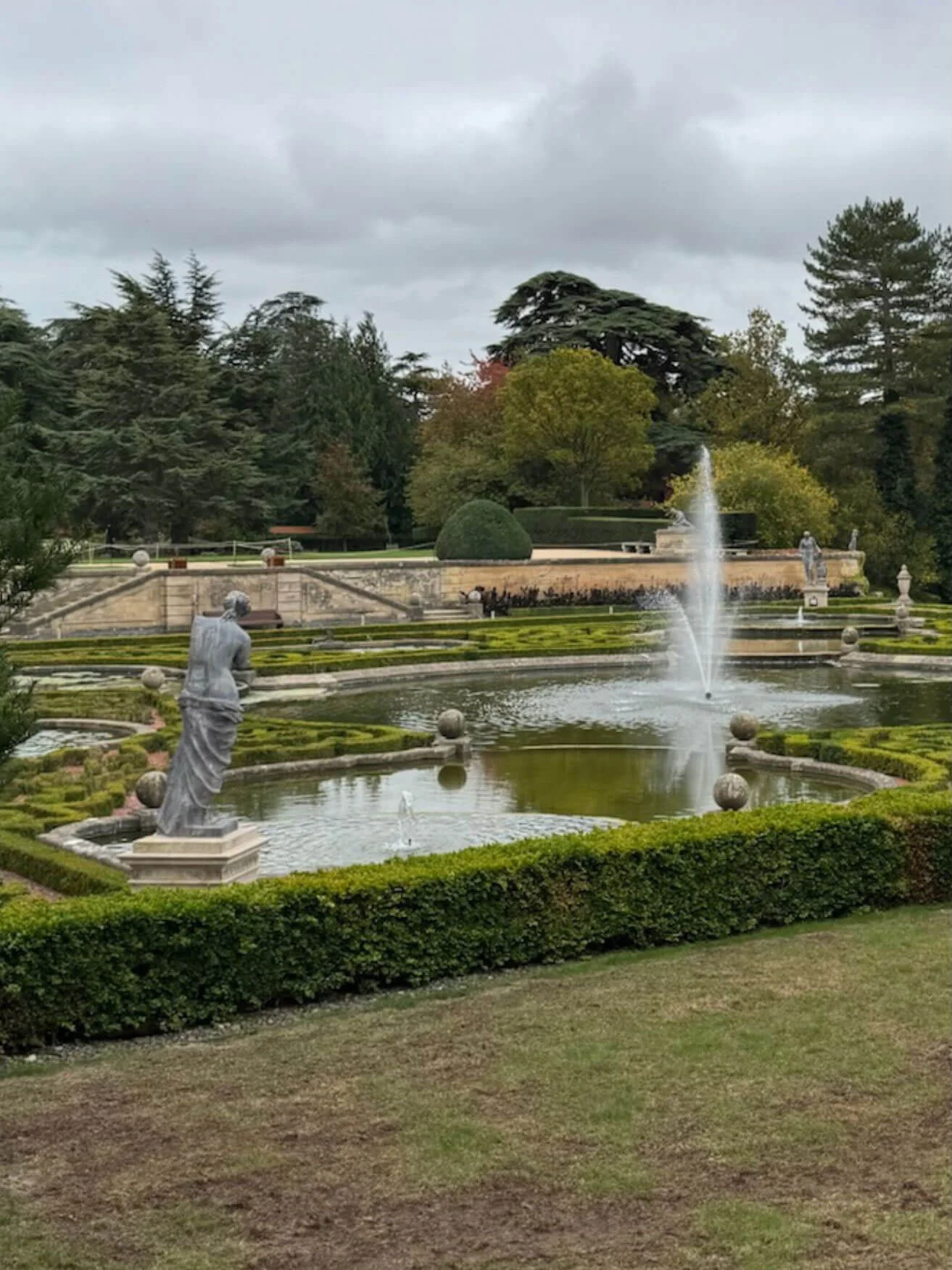 Fountains and statues within formal water gardens