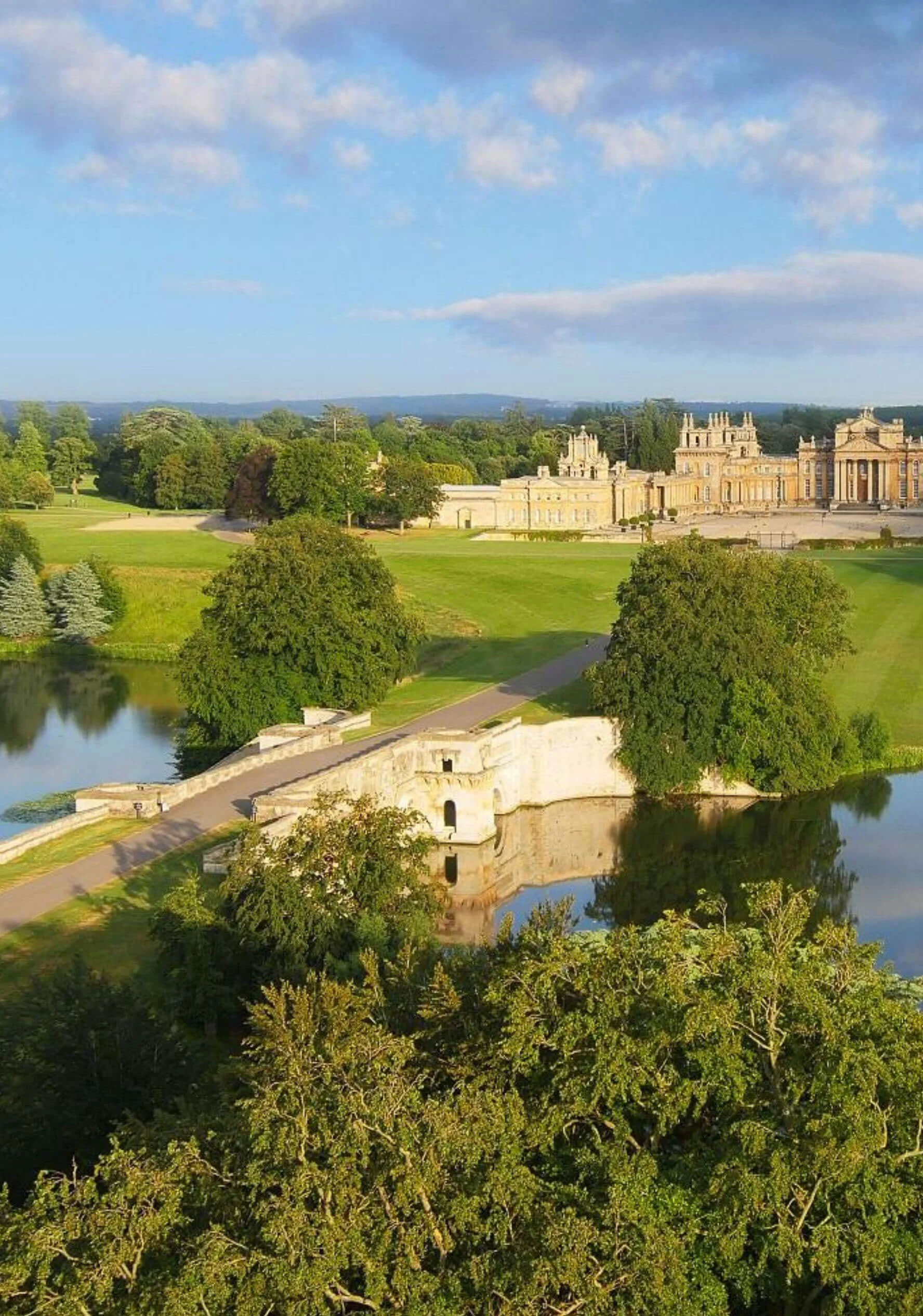 Elevated view of Blenheim Palace, lake and parkland
