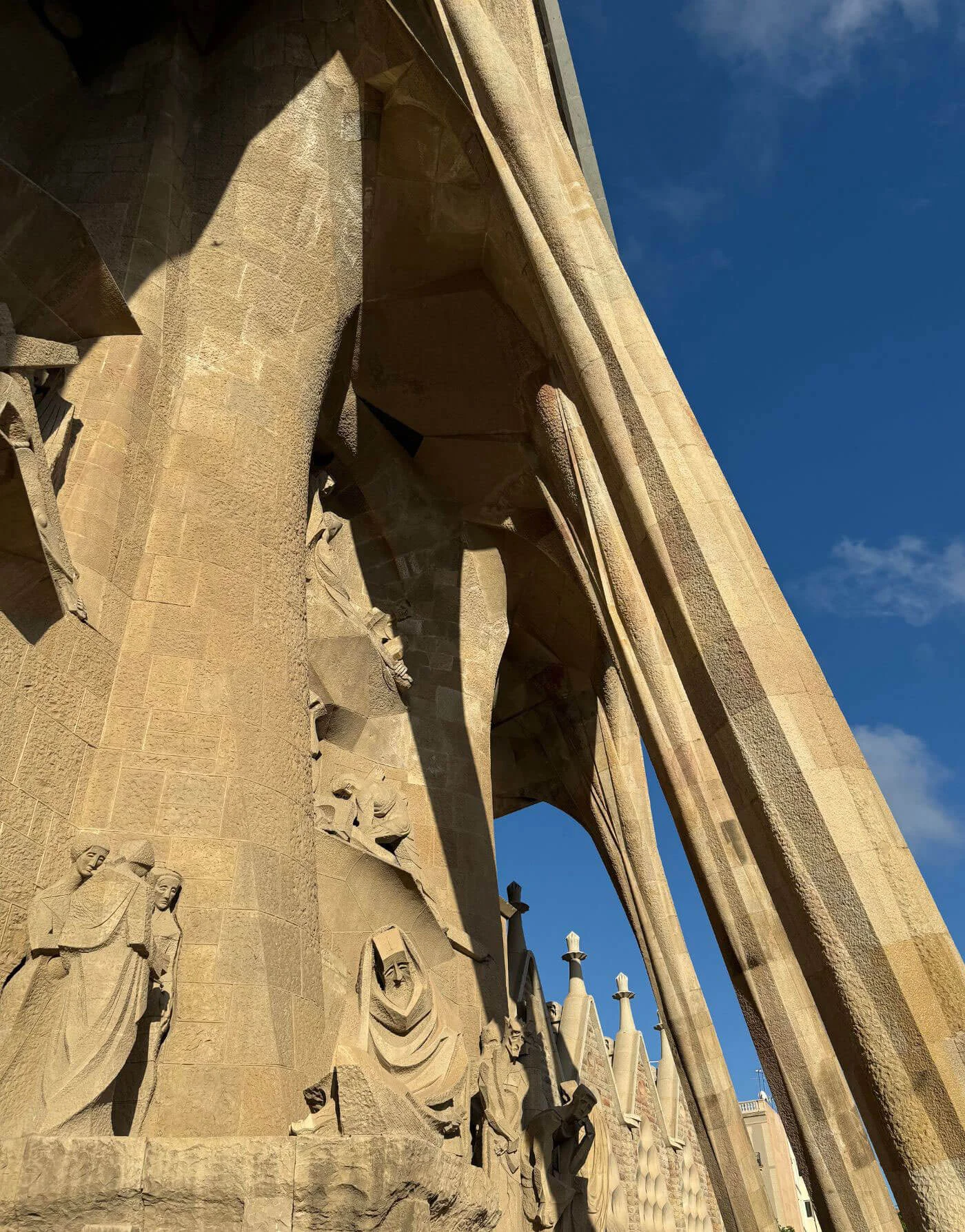 Angular stone entrance columns and carved figures