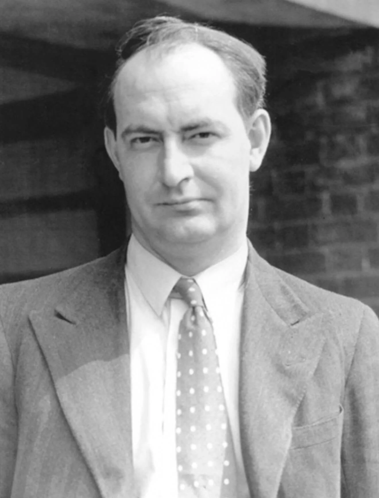 Black-and-white portrait of Malcolm Sayer
