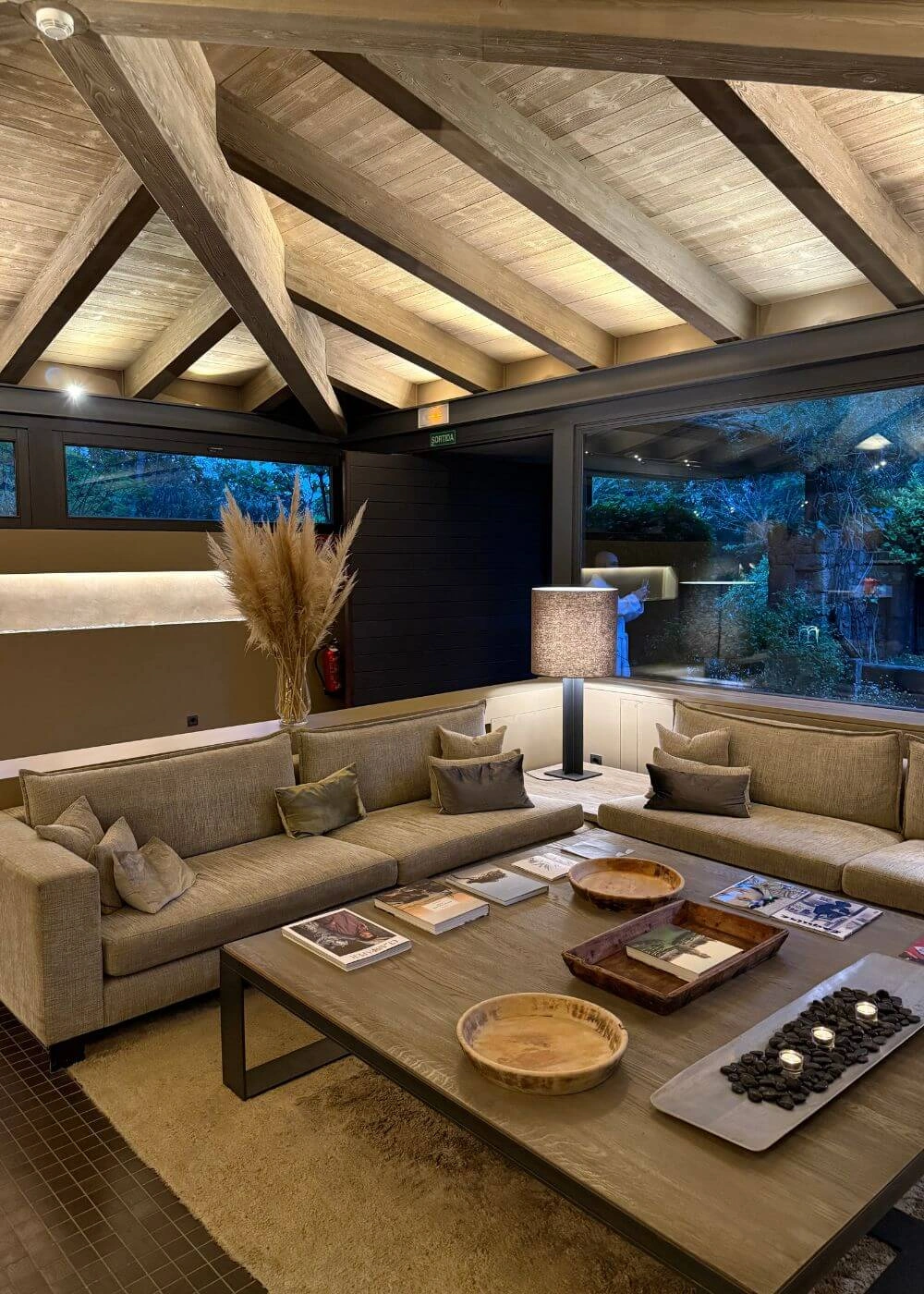 Lounge seating beneath exposed timber roof beams