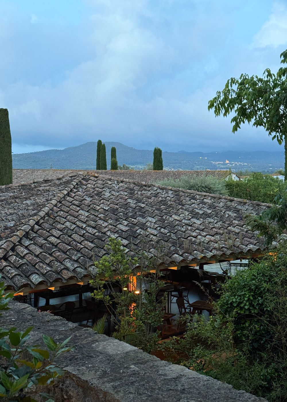 Weathered tile roof overlooking distant countryside