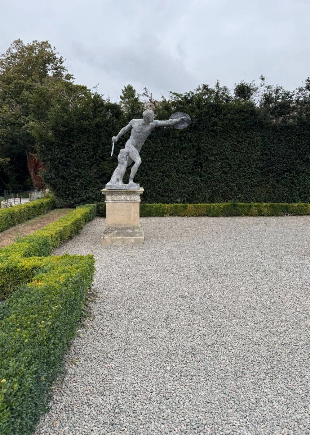 Garden statue beside a gravel path