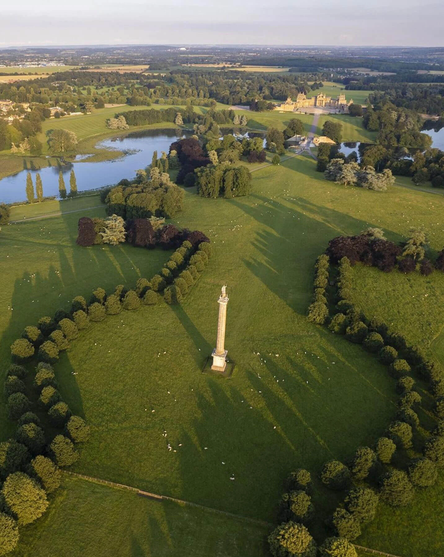 Aerial view of lawns, lake and palace grounds