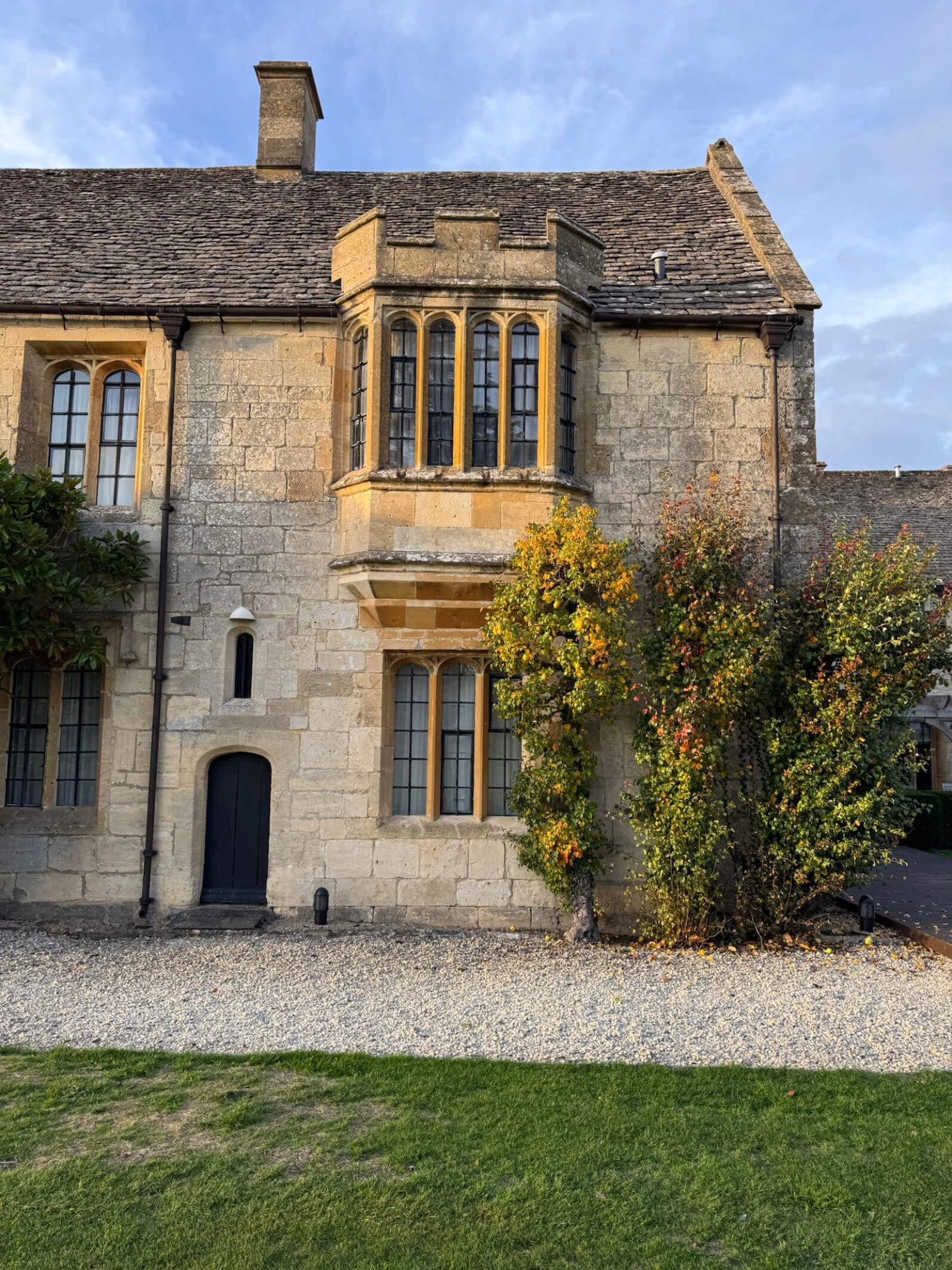 Stone bay window overlooking a gravel courtyard