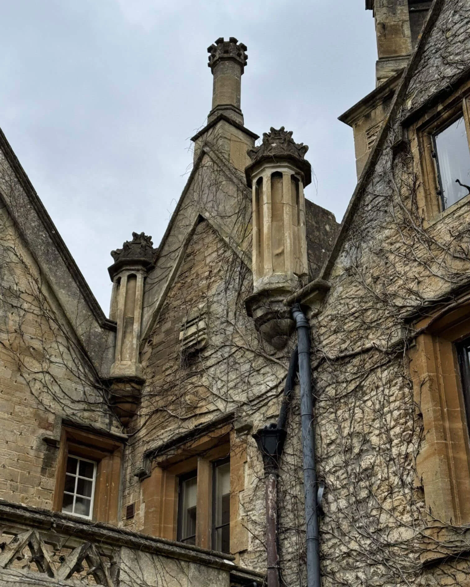 Ornate stone gables and tall chimneys