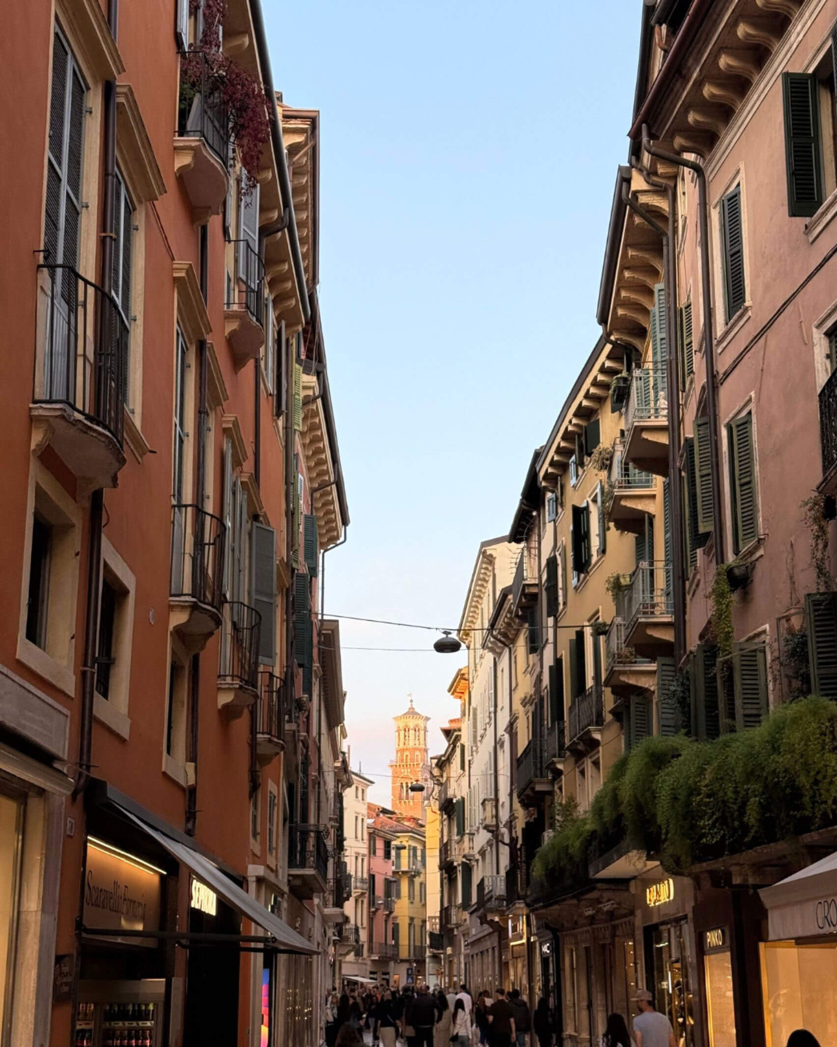 Colourful Verona facades lining a narrow street