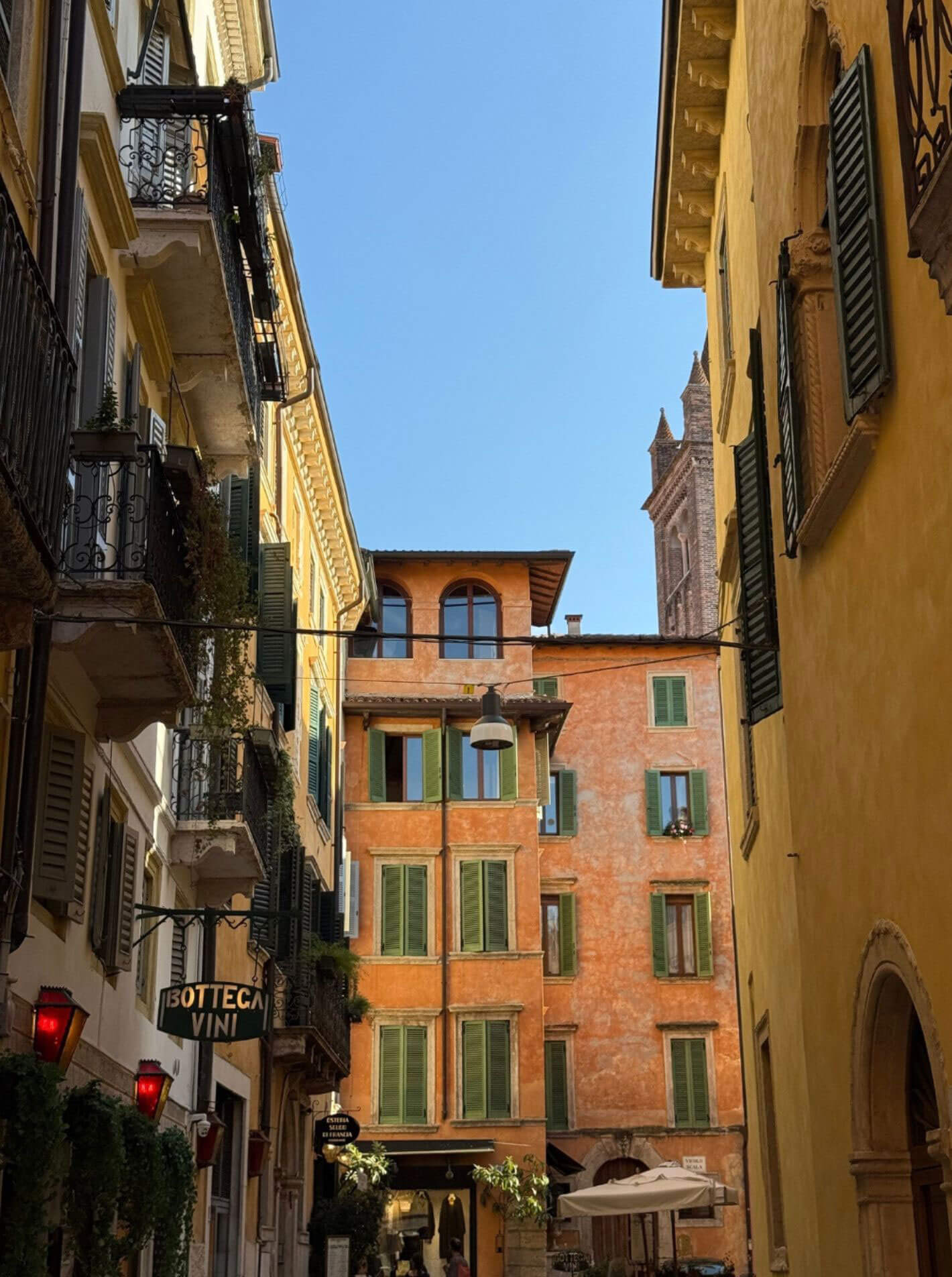 Yellow and orange facades with green shutters