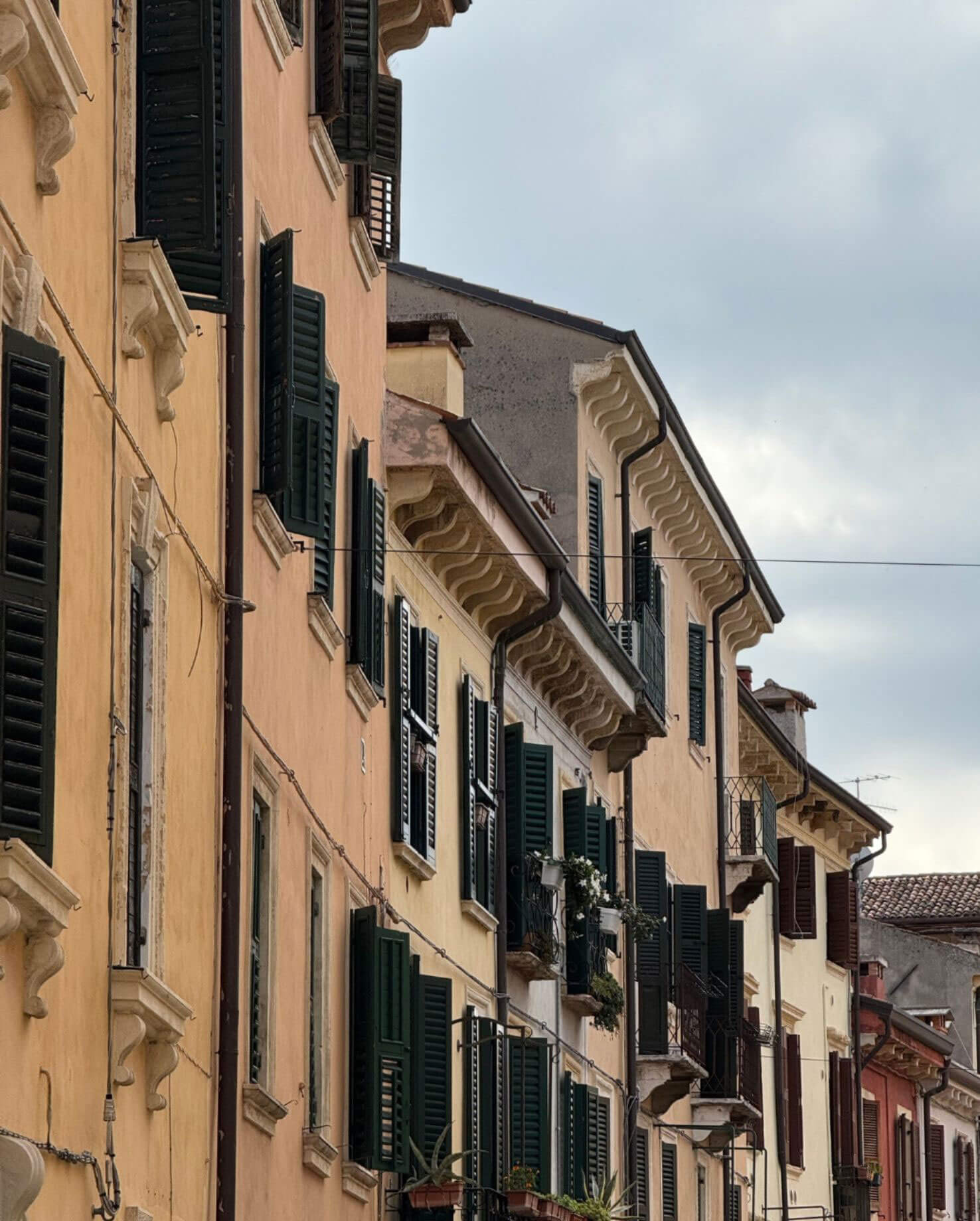 Rows of shutters and wrought-iron balconies