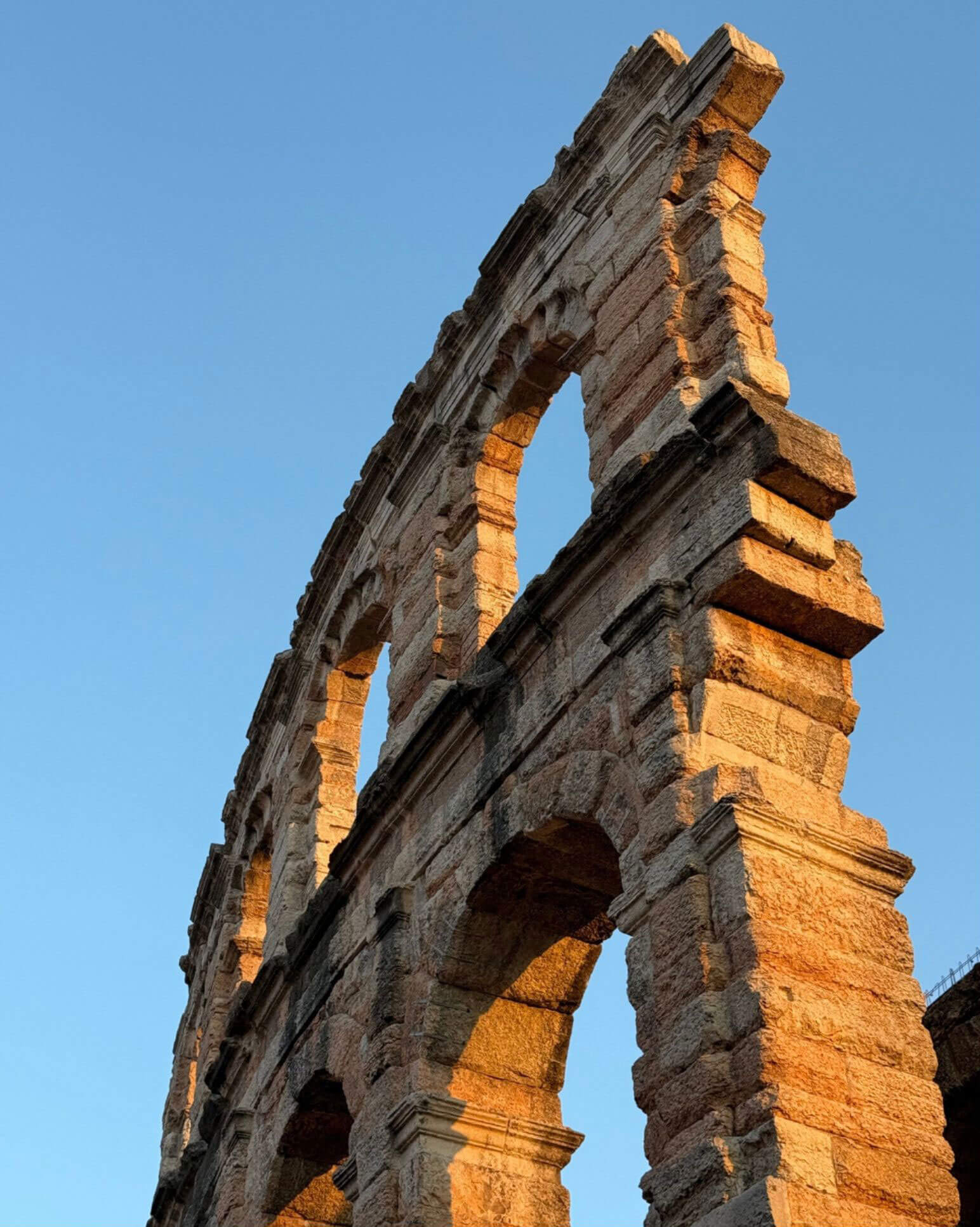 Freestanding stone arches against blue sky