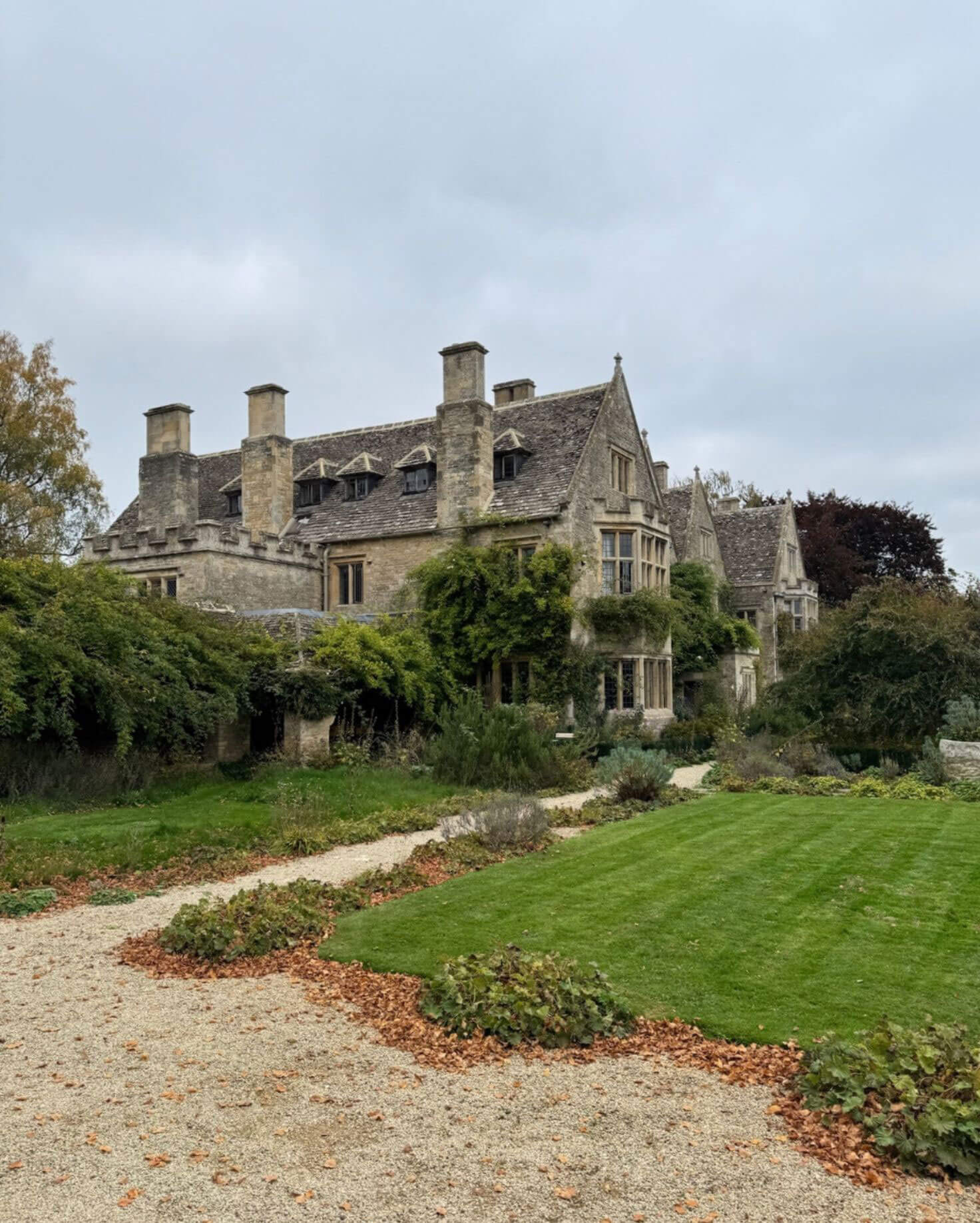 Country manor overlooking a lawn and garden paths