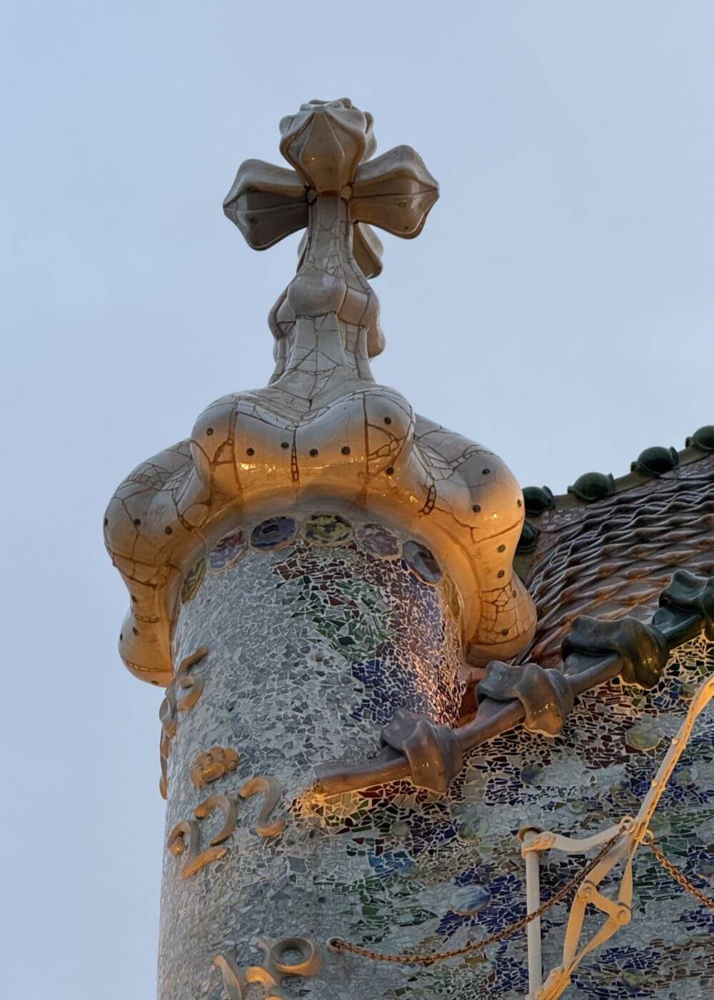 Cross-topped tower above the tiled roof