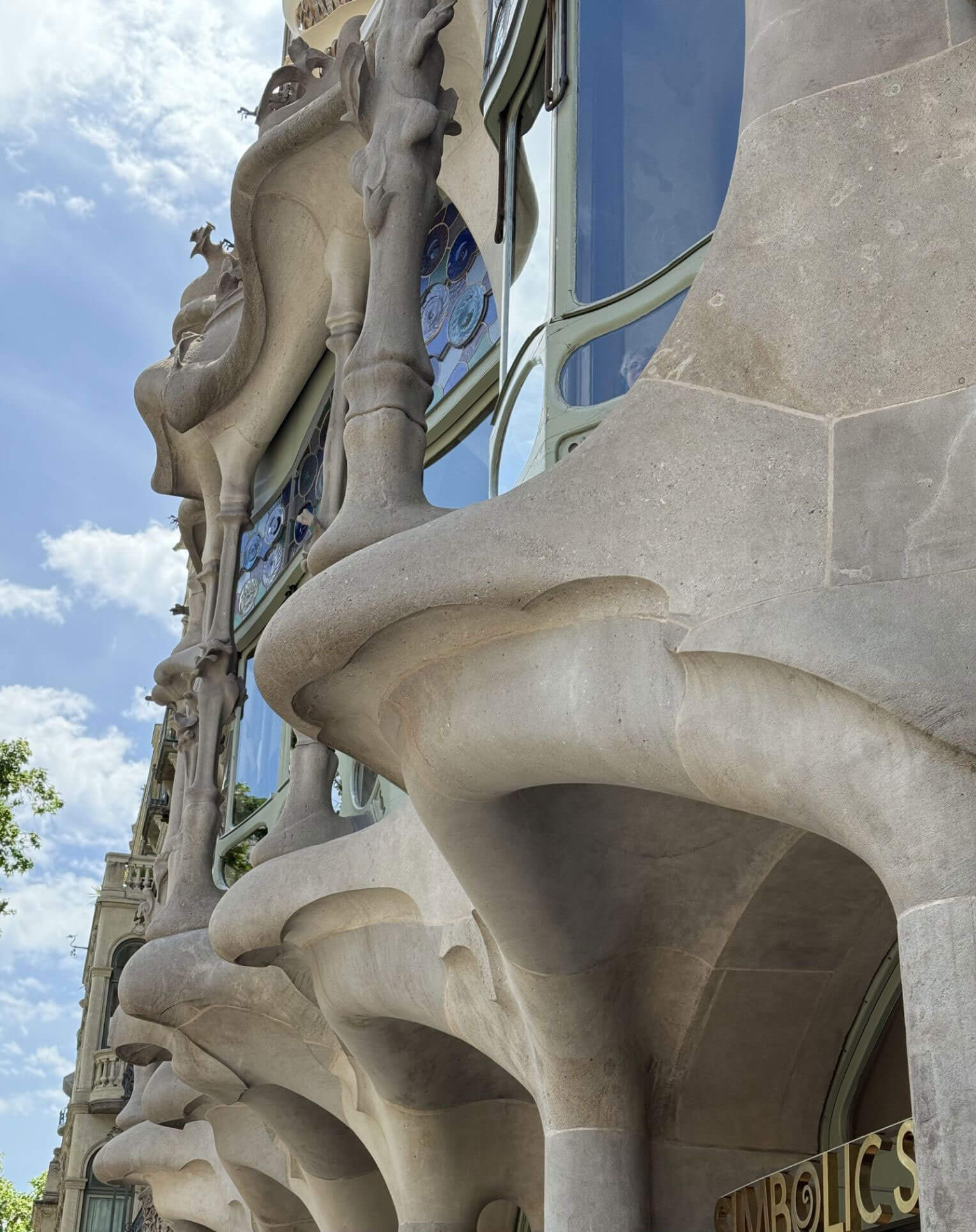 Undulating stone balcony and window details