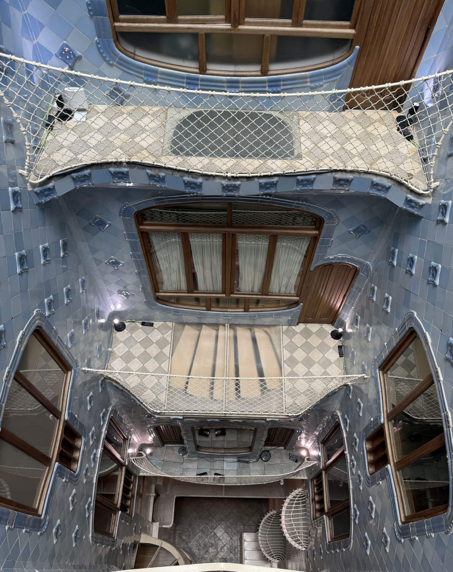 Tiled interior lightwell with sculptural balconies