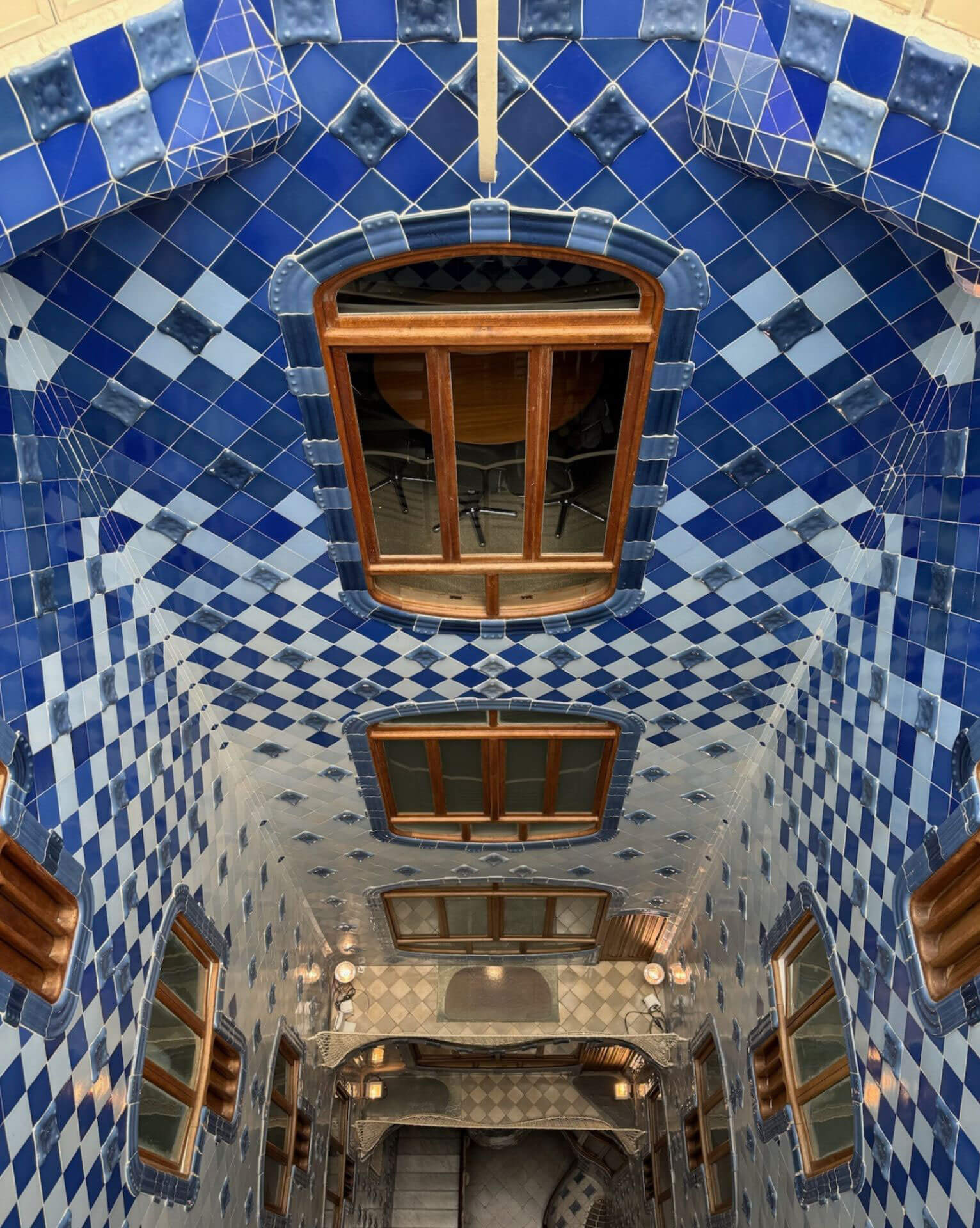 Blue ceramic tiles lining the tall interior courtyard