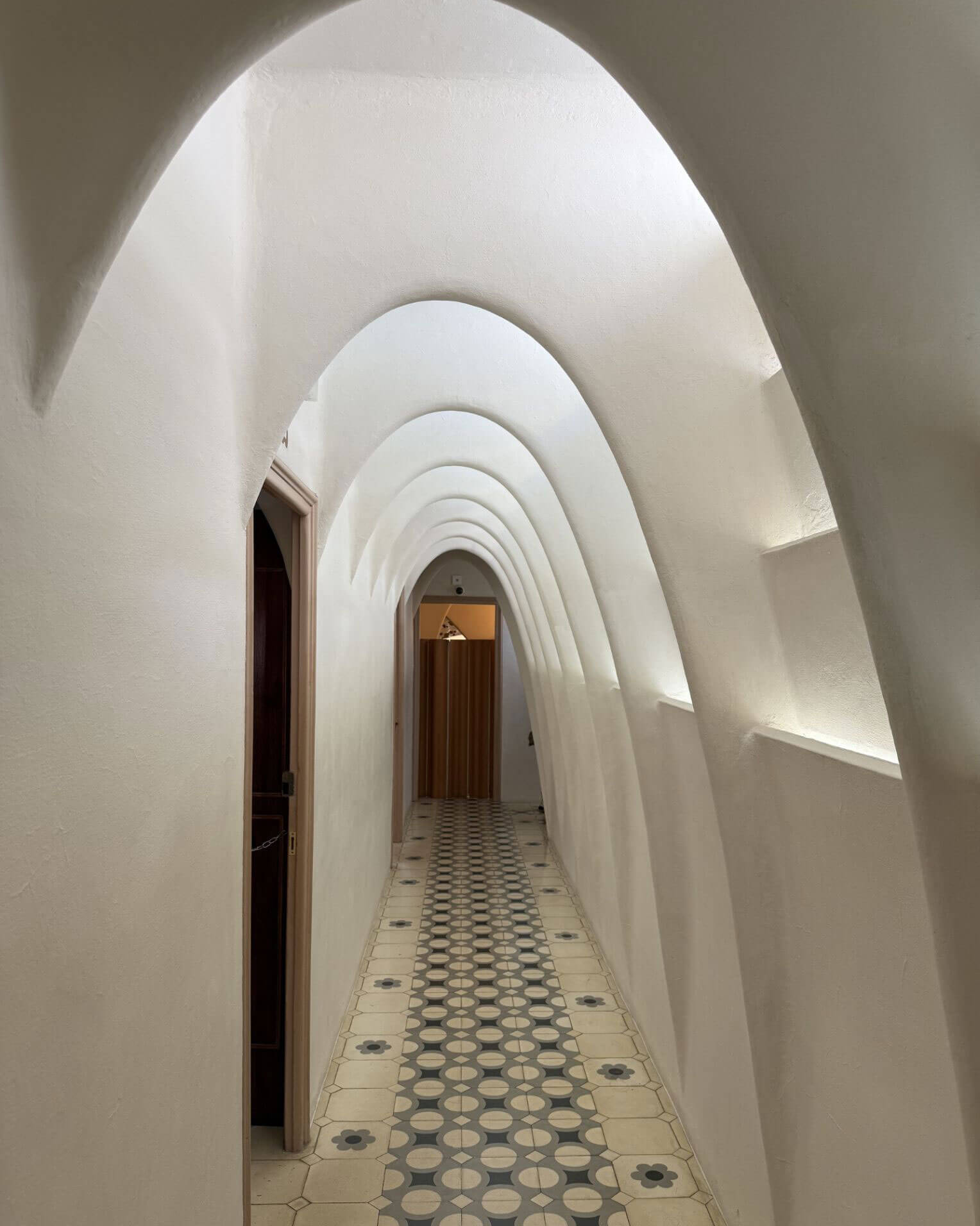 White ribbed arches along the attic passage