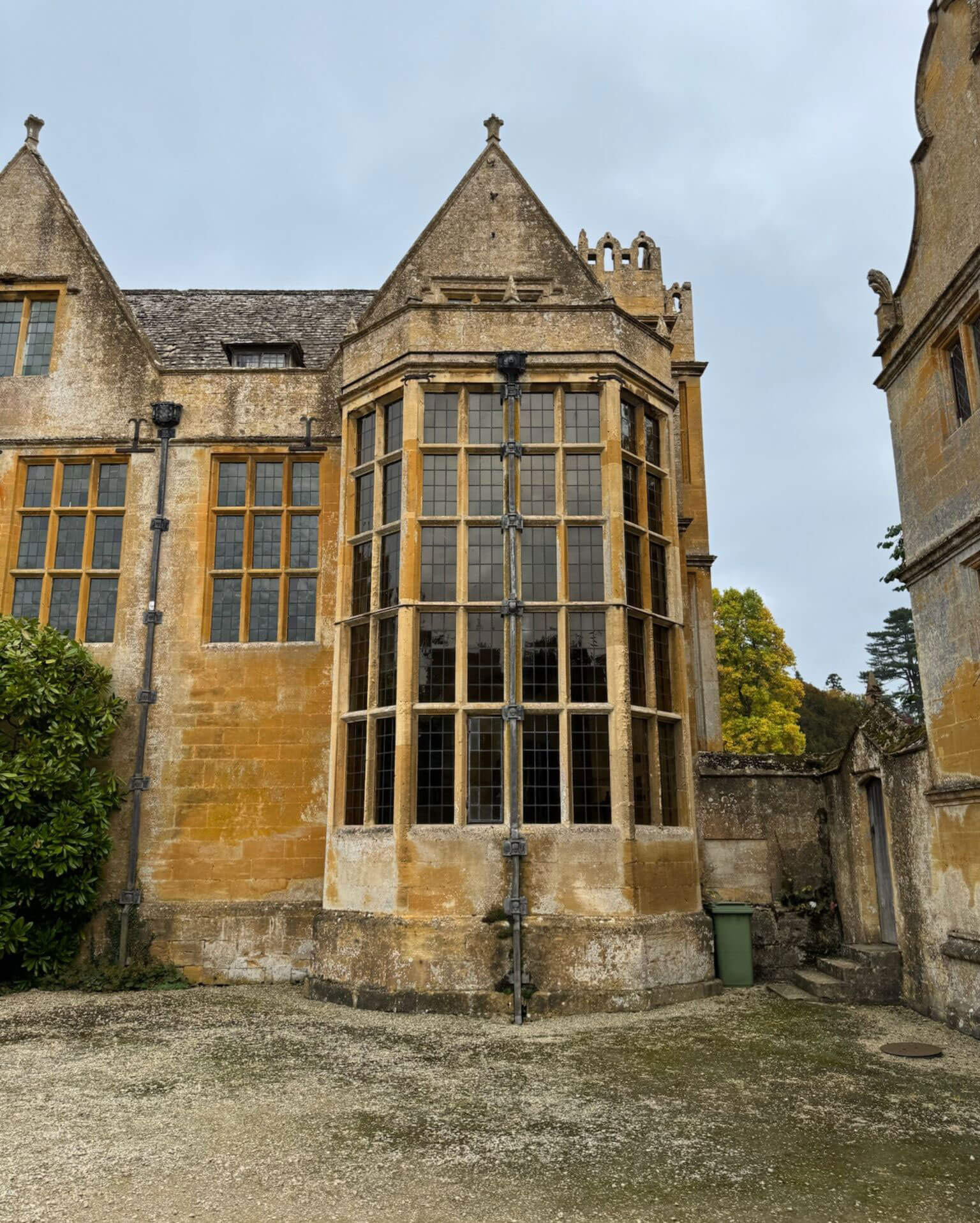 Projecting stone bay with tall leaded windows