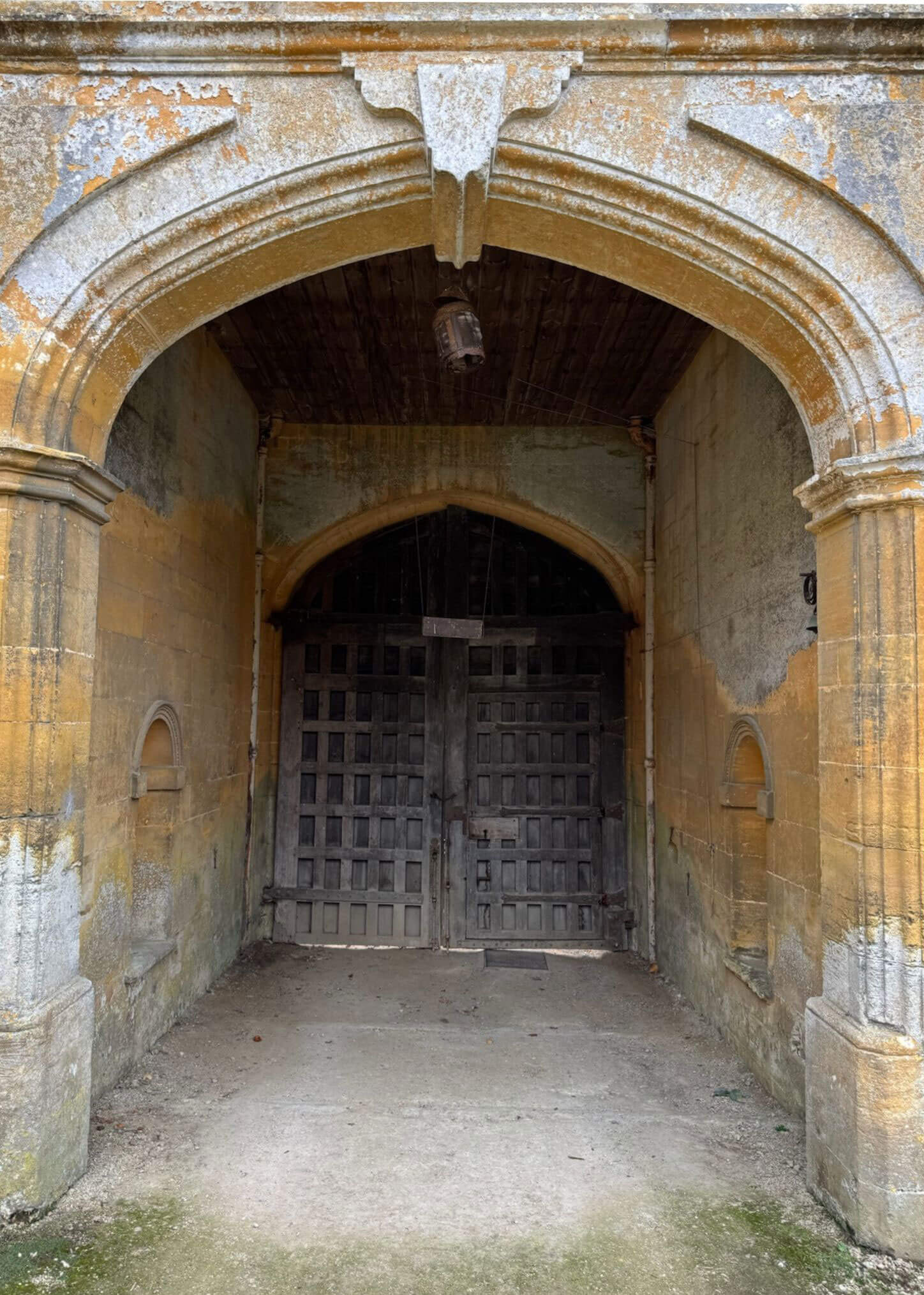 Carved archway and heavy timber gate
