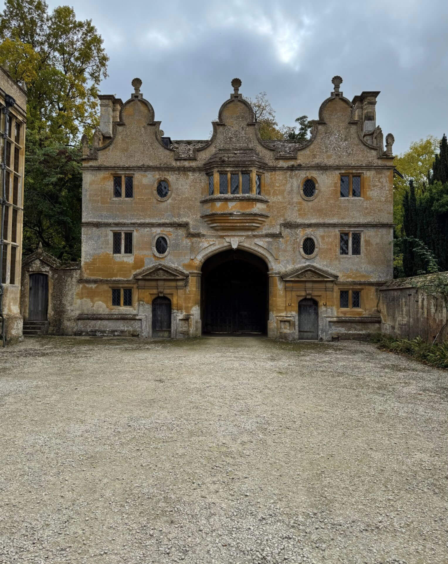Stanway gatehouse across a gravel forecourt