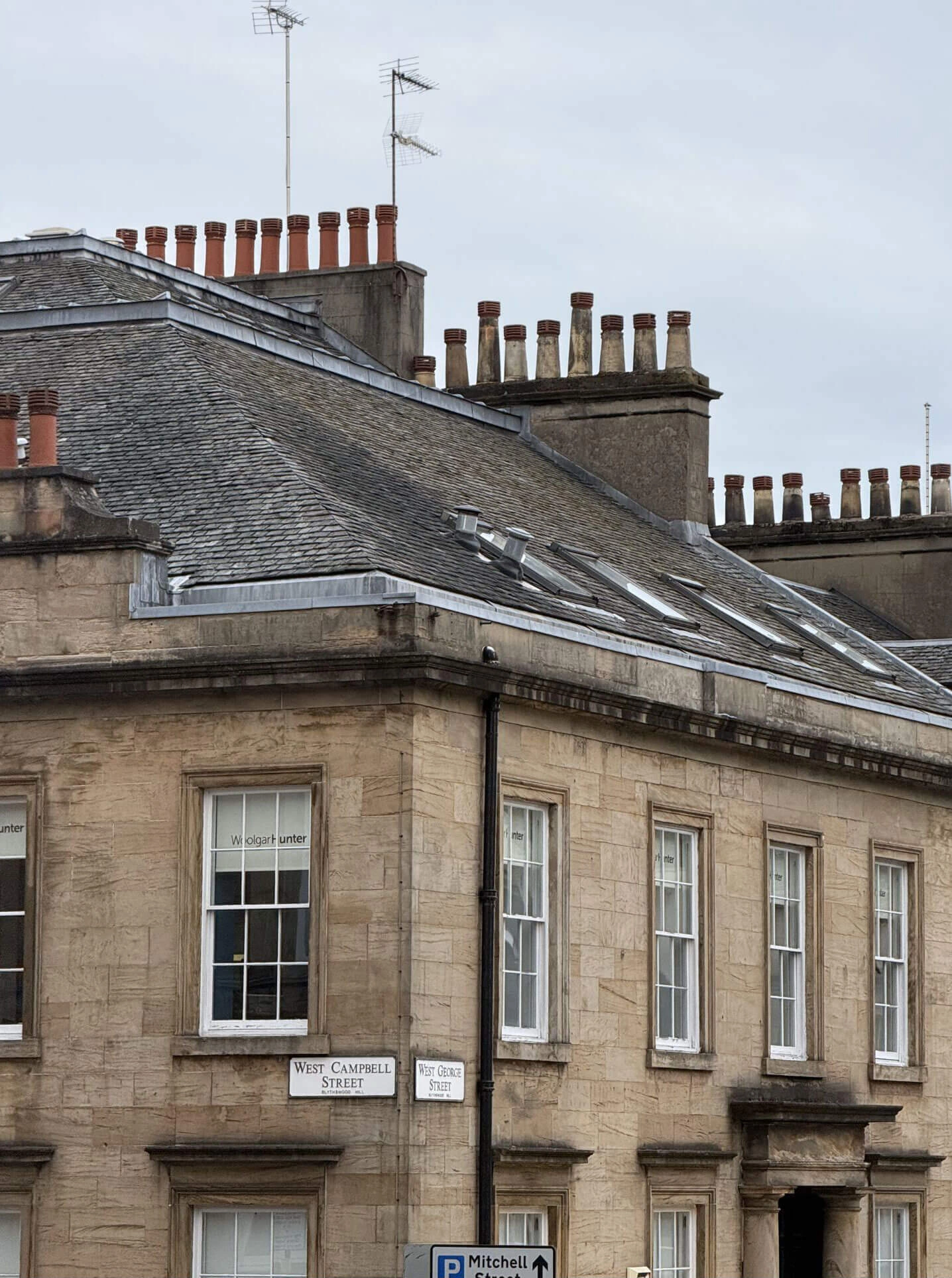 Slate roof with rows of clay chimney pots