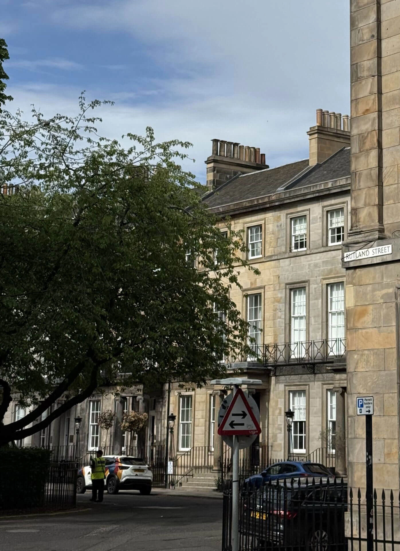 Trees framing a corner stone building