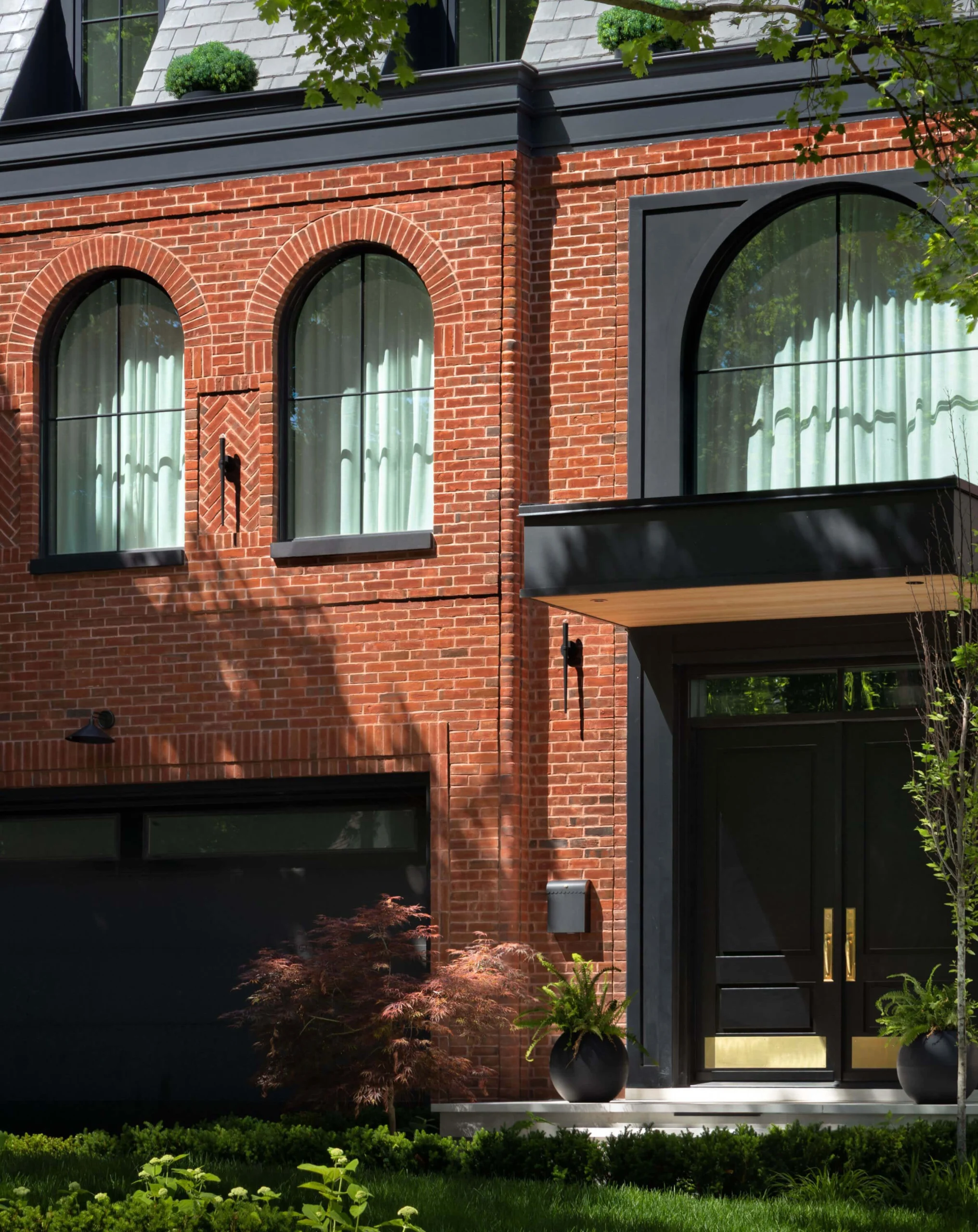 Layered front gardens leading to the Bloor West Brownstone entrance