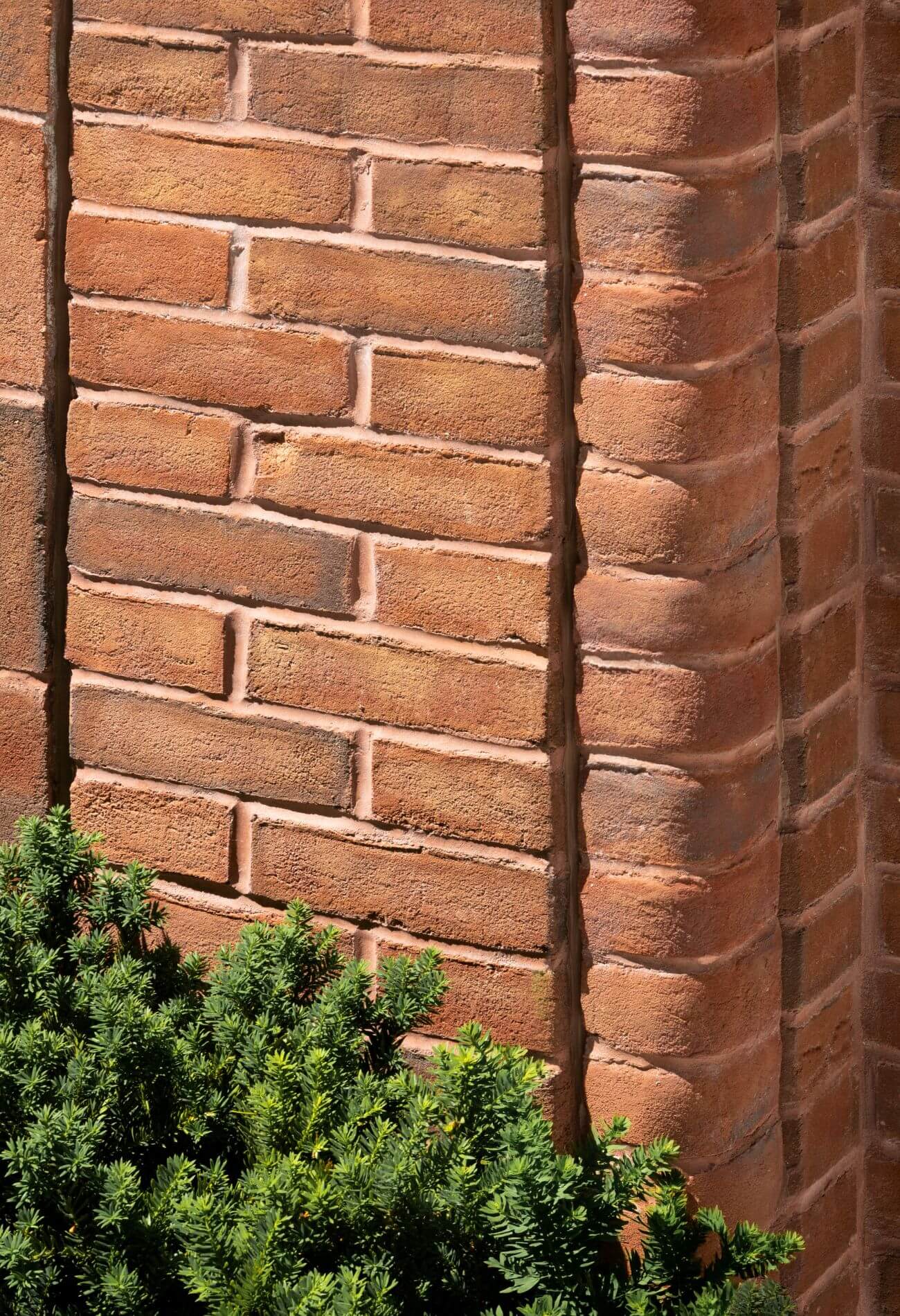 Close view of the brownstone masonry and planting