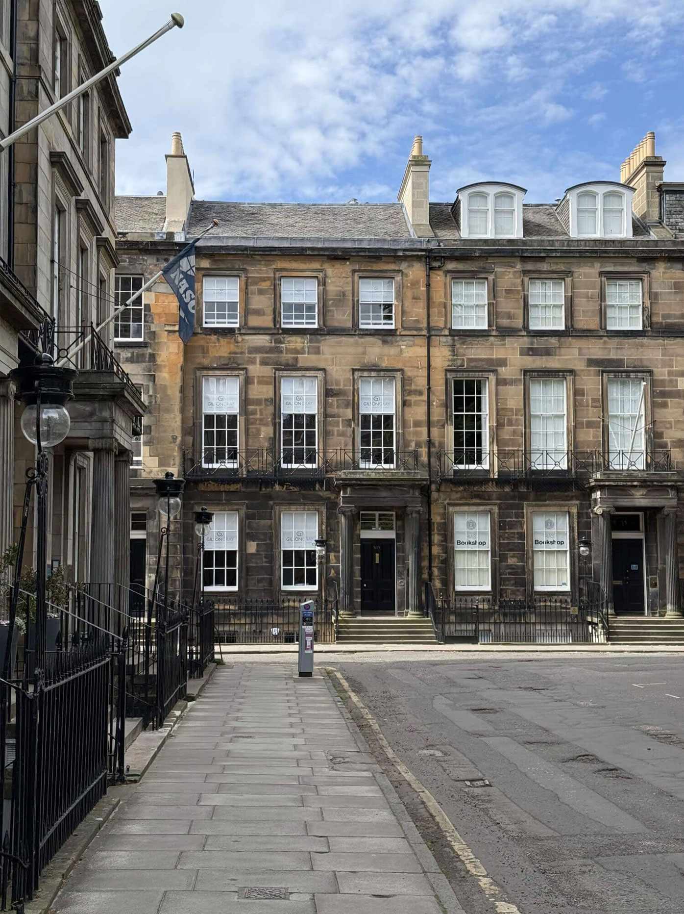 Stone facades and railings at a street corner