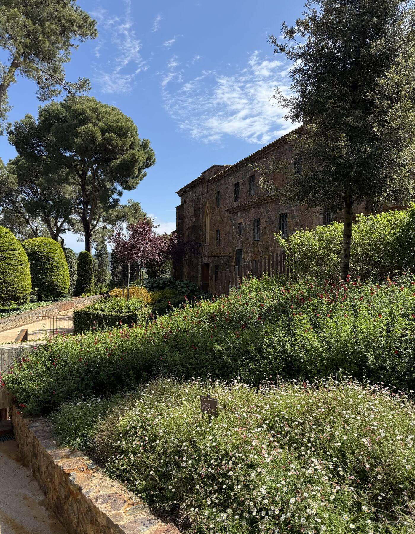 Stone estate building above terraced planting
