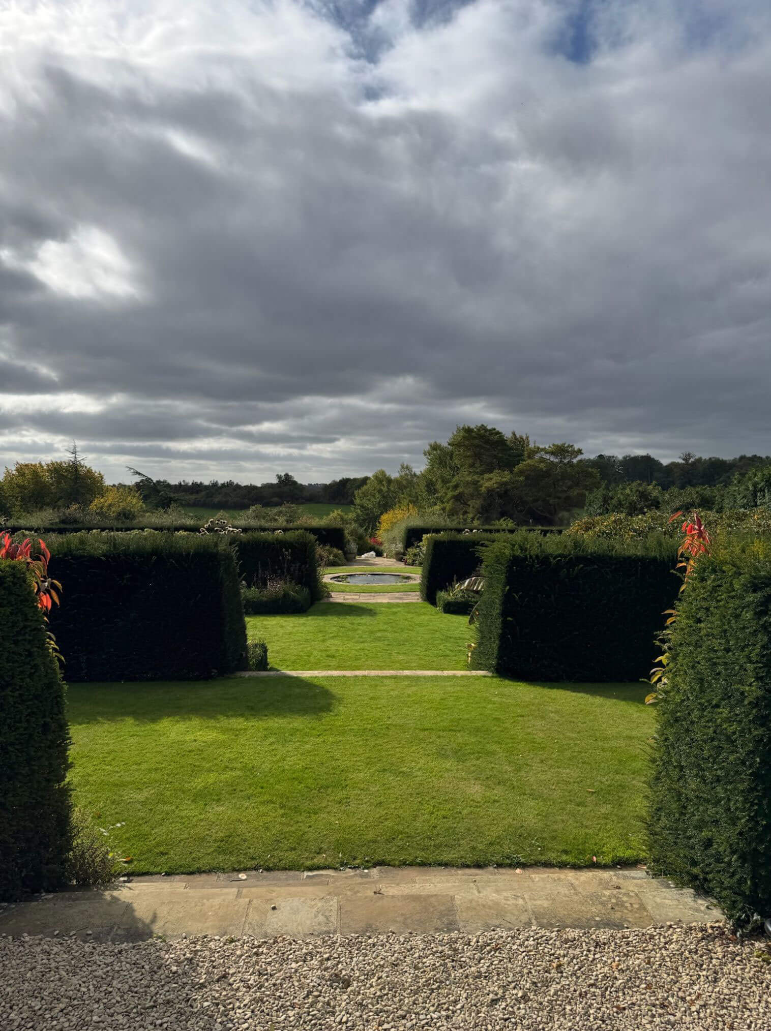Garden rooms divided by clipped hedges