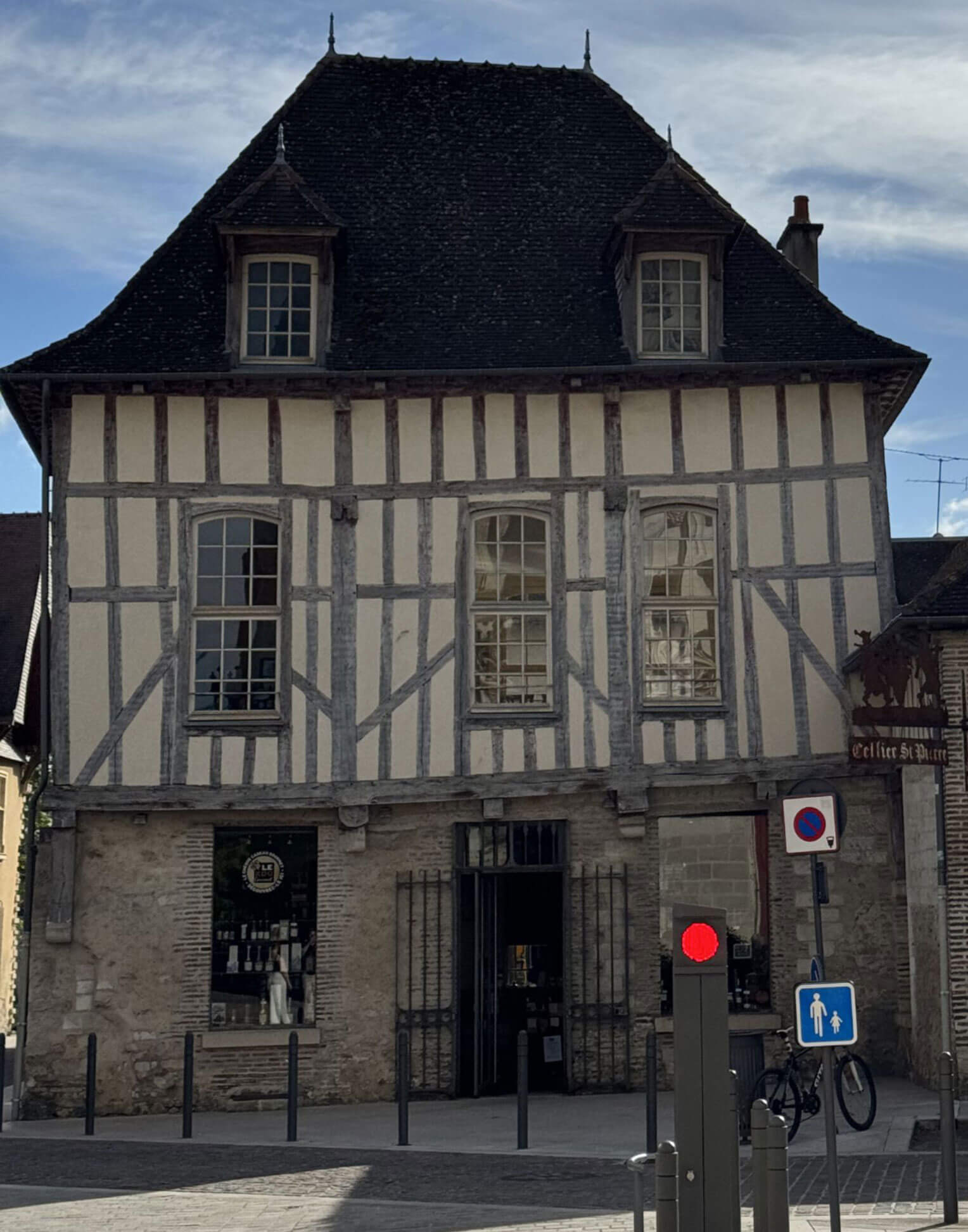 Tall half-timbered house with a steep dark roof