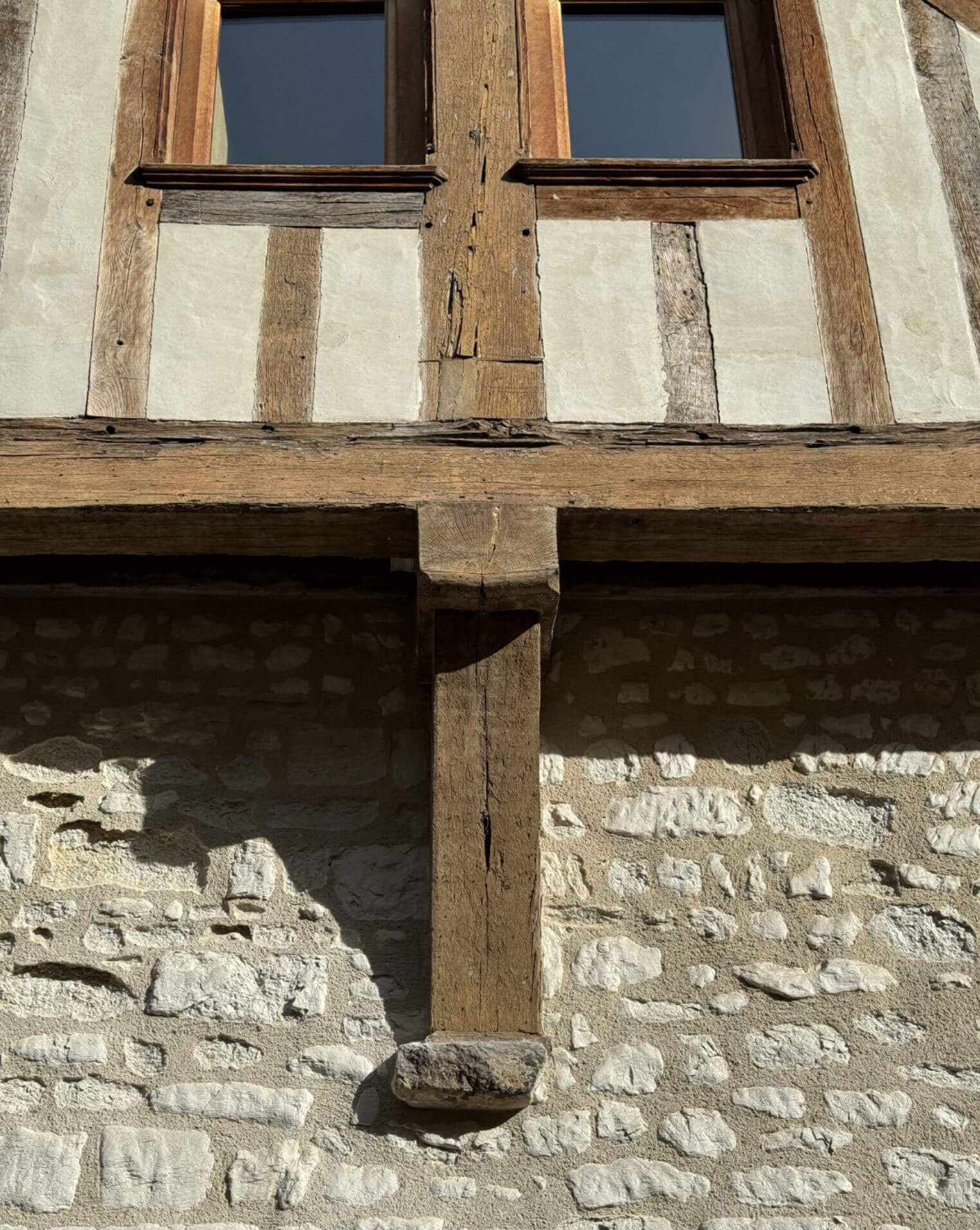 Close view of exposed timber and stone infill