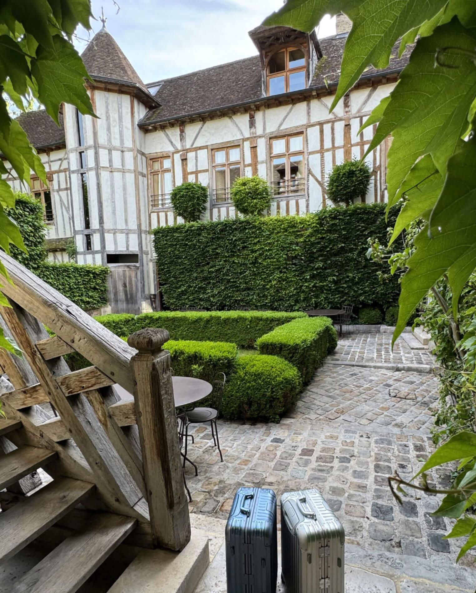 Small courtyard garden enclosed by timber-framed houses