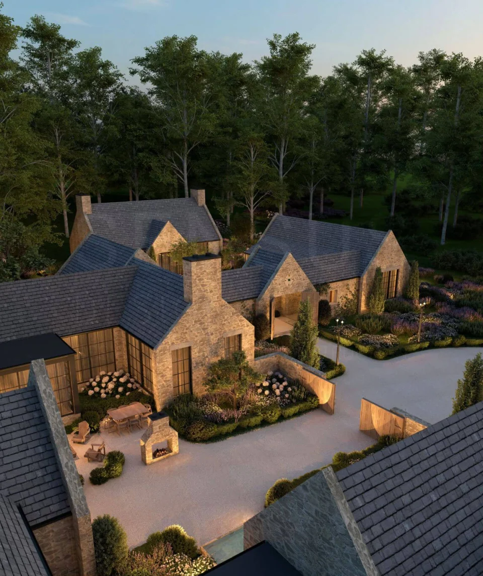 Aerial view of stone homes with slate roofs surrounding a landscaped courtyard